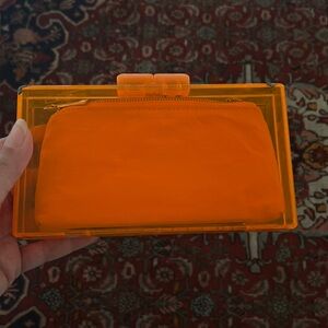 Bright orange clutch